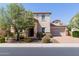 Charming two-story home with stone accents, a well-manicured lawn, and a welcoming front yard at 882 E Parkview Dr, Gilbert, AZ 85295