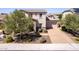 Two-story home with stone accents, a paver driveway, and well-manicured landscaping at 882 E Parkview Dr, Gilbert, AZ 85295