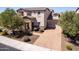 Attractive home with paver driveway, stone details, and well-maintained landscaping at 882 E Parkview Dr, Gilbert, AZ 85295