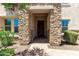 Inviting front entrance featuring a stone facade, brick pathway, and well-maintained landscaping at 882 E Parkview Dr, Gilbert, AZ 85295