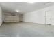 Spacious two car garage with epoxy flooring and access door at 882 E Parkview Dr, Gilbert, AZ 85295