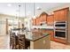 Modern kitchen featuring stainless steel appliances, a large island, and stylish cabinetry at 882 E Parkview Dr, Gilbert, AZ 85295
