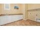 Spacious laundry room has a sink, countertop, and storage cabinets at 882 E Parkview Dr, Gilbert, AZ 85295