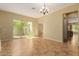 Spacious living room with tile floors and sliding glass doors to the backyard at 882 E Parkview Dr, Gilbert, AZ 85295