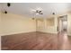 Spacious living room featuring wood floors, ceiling fan and recessed lighting at 882 E Parkview Dr, Gilbert, AZ 85295