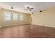 Large living room featuring hardwood floors, ceiling fan and natural light at 882 E Parkview Dr, Gilbert, AZ 85295