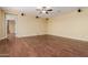 Expansive living room featuring hardwood floors and ceiling fan at 882 E Parkview Dr, Gilbert, AZ 85295