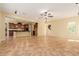 Open-concept living room with kitchen view, offering seamless flow for entertaining and Gathering life at 882 E Parkview Dr, Gilbert, AZ 85295