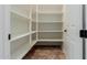 Walk-in pantry with adjustable shelving and ample storage space at 882 E Parkview Dr, Gilbert, AZ 85295