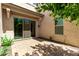 Private patio with brick pavers, offering a serene outdoor living space with a sliding glass door entrance at 882 E Parkview Dr, Gilbert, AZ 85295