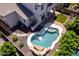 Aerial view of backyard pool with rock features and desert landscaping at 882 E Parkview Dr, Gilbert, AZ 85295