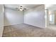Bedroom featuring neutral carpeting, a ceiling fan, and light-colored walls at 15387 W Columbine Dr, Surprise, AZ 85379