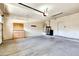 Spacious garage with built-in cabinets, water filtration, and ample open space for multiple cars at 15387 W Columbine Dr, Surprise, AZ 85379