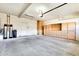Spacious garage with built-in cabinets and shelving offering ample storage space for tools and equipment at 15387 W Columbine Dr, Surprise, AZ 85379