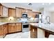 Well-equipped kitchen featuring stainless steel appliances, granite countertops, and lots of cabinets at 15387 W Columbine Dr, Surprise, AZ 85379