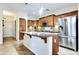Spacious kitchen features granite countertops, an island with pendant lighting, and stainless steel appliances at 15387 W Columbine Dr, Surprise, AZ 85379