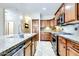 Bright kitchen boasting stainless steel appliances, granite countertops, and ample cabinet storage at 15387 W Columbine Dr, Surprise, AZ 85379