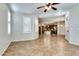 Open-concept living area with tile floors and views of the kitchen at 15387 W Columbine Dr, Surprise, AZ 85379