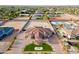 Expansive aerial perspective of the property, displaying its circular driveway, landscaping, and neighboring residences at 16368 W Watkins St, Goodyear, AZ 85338