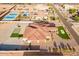 Aerial shot featuring putting green and circular driveway at 16368 W Watkins St, Goodyear, AZ 85338