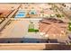 Aerial view of circular drive, putting green and community at 16368 W Watkins St, Goodyear, AZ 85338