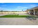 This large backyard boasts a spacious patio, artificial turf accents, and a putting green for outdoor enjoyment at 16368 W Watkins St, Goodyear, AZ 85338