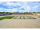 Spacious backyard with a large patio featuring artificial turf sections, offering low-maintenance and visually appealing space at 16368 W Watkins St, Goodyear, AZ 85338