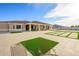 Large backyard showcases a spacious patio with artificial turf, perfect for outdoor entertaining and relaxation at 16368 W Watkins St, Goodyear, AZ 85338