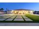 A spacious backyard features an expansive patio with a putting green for outdoor enjoyment at 16368 W Watkins St, Goodyear, AZ 85338