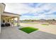 Expansive backyard features an expansive patio with artificial turf accents, providing a low-maintenance and visually appealing space at 16368 W Watkins St, Goodyear, AZ 85338