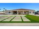 The home's backyard boasts a large patio with artificial turf sections and a putting green, offering ample space for recreation at 16368 W Watkins St, Goodyear, AZ 85338