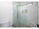 Contemporary shower with frameless glass, rainfall shower head, and mosaic tile accents for a spa-like experience at 16368 W Watkins St, Goodyear, AZ 85338
