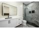 Modern bathroom featuring a vanity, large mirror, and a frameless glass shower at 16368 W Watkins St, Goodyear, AZ 85338