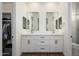 Modern bathroom with double vanity, sleek mirrors, and contemporary finishes, offering ample storage space at 16368 W Watkins St, Goodyear, AZ 85338