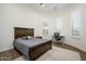Bedroom featuring wood accents, desk space, carpet, and modern decor at 16368 W Watkins St, Goodyear, AZ 85338