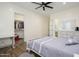 Bright bedroom with a ceiling fan, wood floors, and a walk-in closet at 16368 W Watkins St, Goodyear, AZ 85338