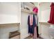 Walk-in closet featuring rod racks, shelving, and lighting at 16368 W Watkins St, Goodyear, AZ 85338