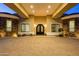 Impressive entrance with stone accents and an arched doorway, leading to a welcoming residence at 16368 W Watkins St, Goodyear, AZ 85338
