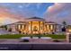 Elegant home with manicured landscaping and a charming fountain, perfect for curb appeal at 16368 W Watkins St, Goodyear, AZ 85338