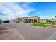 Impressive home showcasing a circular driveway, portico entrance, and beautifully landscaped front yard at 16368 W Watkins St, Goodyear, AZ 85338