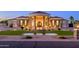 Stunning home with elegant architecture, lush landscaping, and a charming water feature at 16368 W Watkins St, Goodyear, AZ 85338