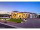 Beautiful single-Gathering home with lush landscaping and an inviting circular driveway at 16368 W Watkins St, Goodyear, AZ 85338
