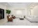 Spacious living room featuring recessed lighting, plush sofas, leather chairs, and a stylish area rug at 16368 W Watkins St, Goodyear, AZ 85338