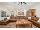 Bright open concept living space with a kitchen, dining area, and comfortable leather sectional at 16368 W Watkins St, Goodyear, AZ 85338