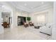 Expansive living area with abundant natural light, neutral tones, elegant columns, and tiled flooring at 16368 W Watkins St, Goodyear, AZ 85338