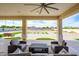 Inviting covered patio features comfortable outdoor seating and elegant columns, creating a perfect space for relaxation at 16368 W Watkins St, Goodyear, AZ 85338