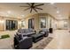Covered patio with ample seating area, ceiling fan and outdoor access perfect for relaxing and entertaining at 16368 W Watkins St, Goodyear, AZ 85338