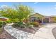 Beautiful home featuring mature landscaping and a winding walkway leading to a cozy front porch at 18129 N 65Th Pl, Phoenix, AZ 85054