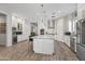 Contemporary kitchen with a large island, stainless steel appliances, and plenty of storage, ideal for cooking and entertaining at 18129 N 65Th Pl, Phoenix, AZ 85054