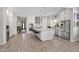 Bright, open kitchen with a large island, stainless steel appliances, and ample cabinet space for storage and organization at 18129 N 65Th Pl, Phoenix, AZ 85054